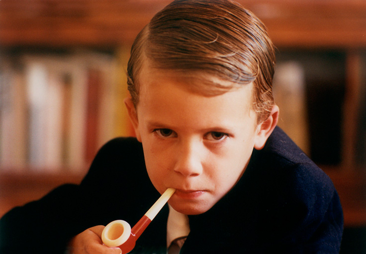 Portrait photography is a field rife with clichés. Some like to toy with those clichés, as with this little executive and his bubble pipe, sternly eyeing a visitor to his office. Someday we’ll all be working for this guy. From 'Portrait Photography' by Eric Wrobbel, here: https://www.ericwrobbel.com/art/portraits.htm