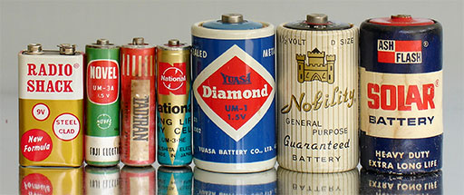 Vintage batteries Radio Shack 006P (9V, Japan), Novel UM-3A (1.5V, Japan), Tadiran R15 (1.5V, origin not visible), National UM-3-HE (1.5V, Matsushita Electric, Japan), Yuasa Diamond UM-1 (1.5V, Japan), Nobility 'D Size' (1.5V, 'Made in Japan for U.S. Glass Corporation, New York'), Solar (Ash Flash) No. 924, (1.5V, Hong Kong). from 'More Batteries' at the web's largest private collection of antiques & collectibles at https://www.ericwrobbel.com/collections/batteries-2.htm