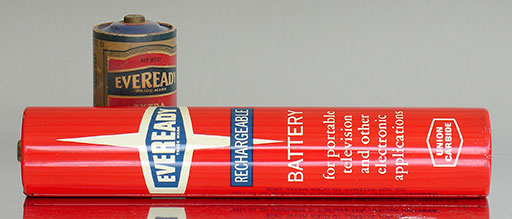 Vintage battery: Eveready No. 563 (4.5V, USA). This monster is rechargeable but the chemistry isn't stated. 'For portable television and other electronic applications.' Behind is an old Eveready D-cell 950 for size reference. From 'More Batteries' at the web's largest private collection of antiques & collectibles at https://www.ericwrobbel.com/collections/batteries-2.htm