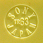 Early Sony TR-63 transistor radio models from 1957 were marked in a small debossed circle on the back with the company's original name, Tokyo Tsushin Kogyo, Ltd. Later examples in 1958, like this one, dropped the Tokyo Tsushin name in favor of the new corporate name, Sony. From 'Collecting Variants' at the web's largest private collection of antiques & collectibles: https://www.ericwrobbel.com/collections/collecting-variants.htm