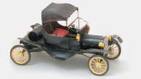 This vintage and very fragile model is made of balsa wood and feels like little more than paper. It is a Hudson Miniature model of a 1910 Ford Model T Torpedo from their 'Old Timers' series (1949, USA). From 'More Toys' at the web's largest private collection of antiques & collectibles: https://www.ericwrobbel.com/collections