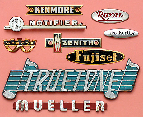 Vintage collectible lettering and nameplates: Kenmore, Royal, Notifier, Featherlite, Webcor, Zenith, Fujiset, Truetone, Mueller. The Kenmore and Zenith cloisonné badges are from sewing machines. The Webcor and Truetone badges are off of electronic sound equipment. From 'More Nameplates and Lettering' at the web's largest private collection of antiques & collectibles: https://www.ericwrobbel.com/collections/nameplates-lettering-2.htm